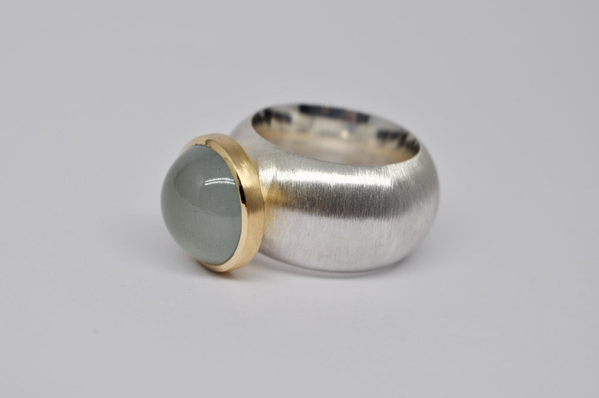 Silver, 18k yellow gold, aquamarine cabochon