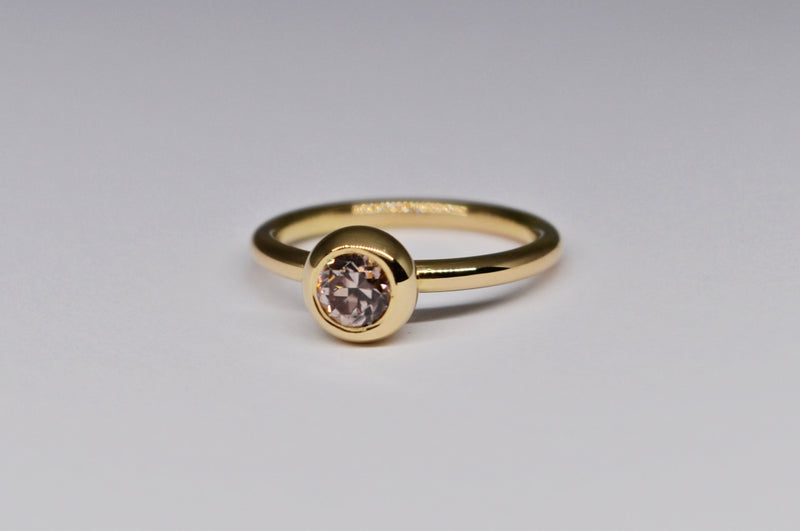 Bezel-Set Pink Zircon Ring in 18K Yellow Gold