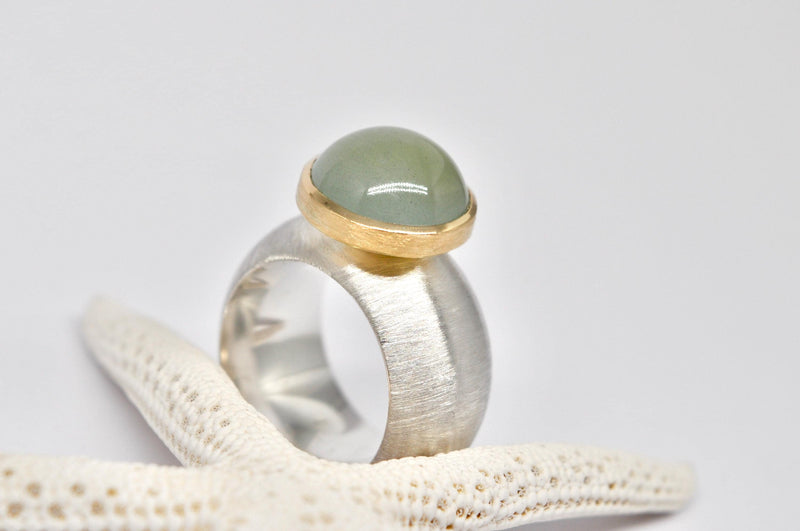Silver, 18k yellow gold, aquamarine cabochon