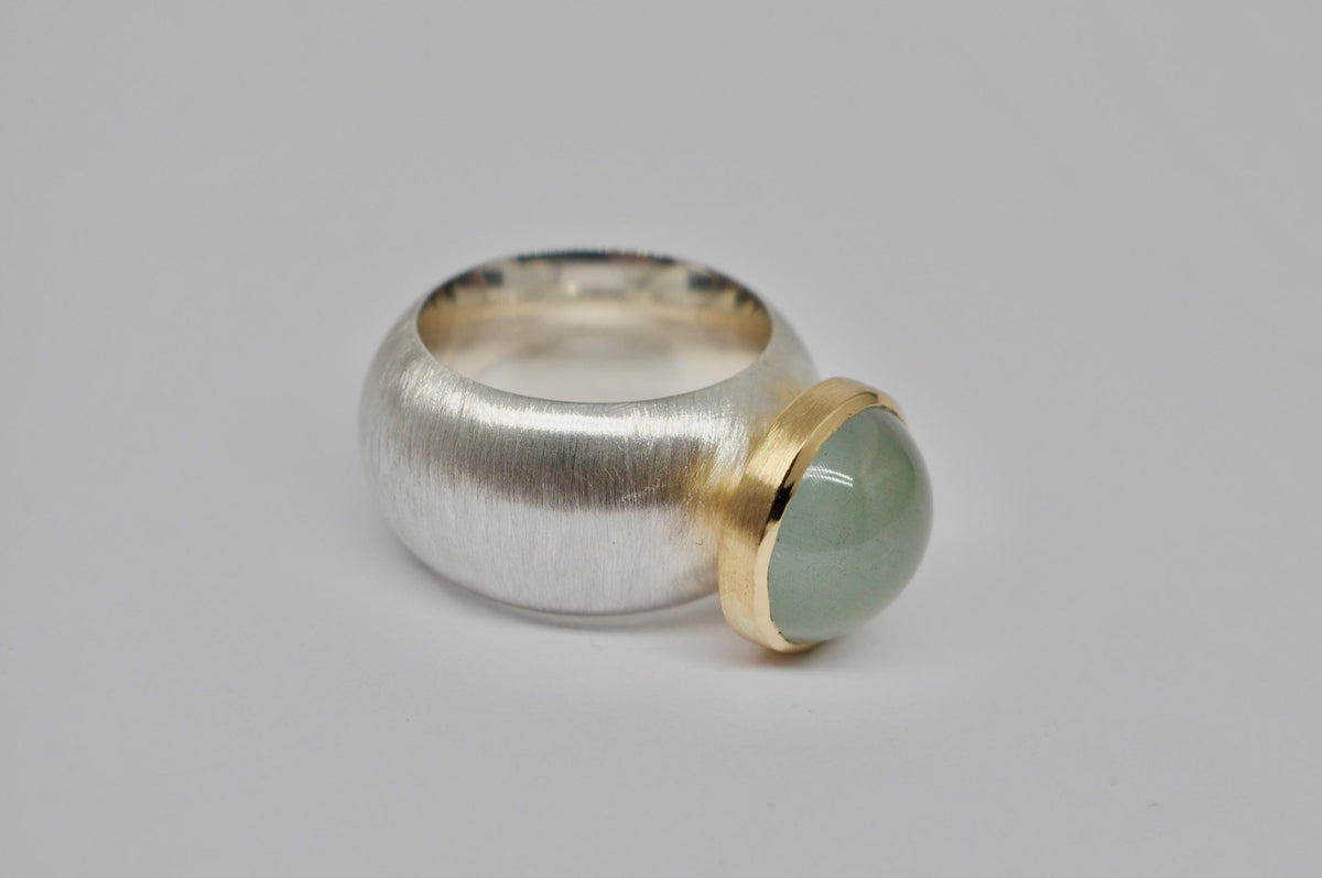 Silver, 18k yellow gold, aquamarine cabochon